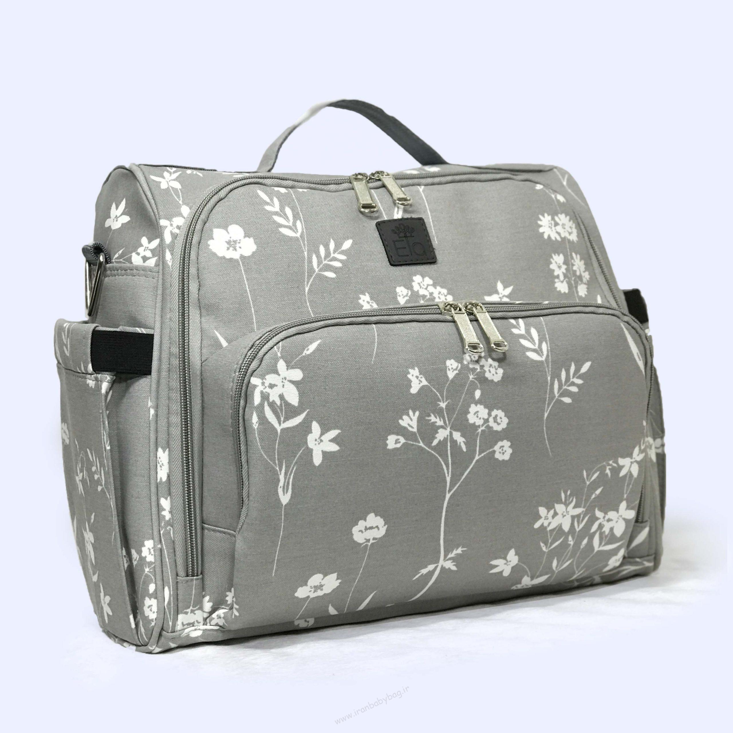 ساک لوازم نوزاد یونا کوله پشتی لوازم نوزاد یونا گلدار طوسی،کیف چند کاره نوزادی