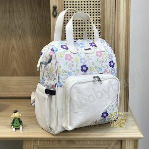 کوله پشتی لوازم نوزاد گلدار کرم ، کیف نوزادی رنگ شاد