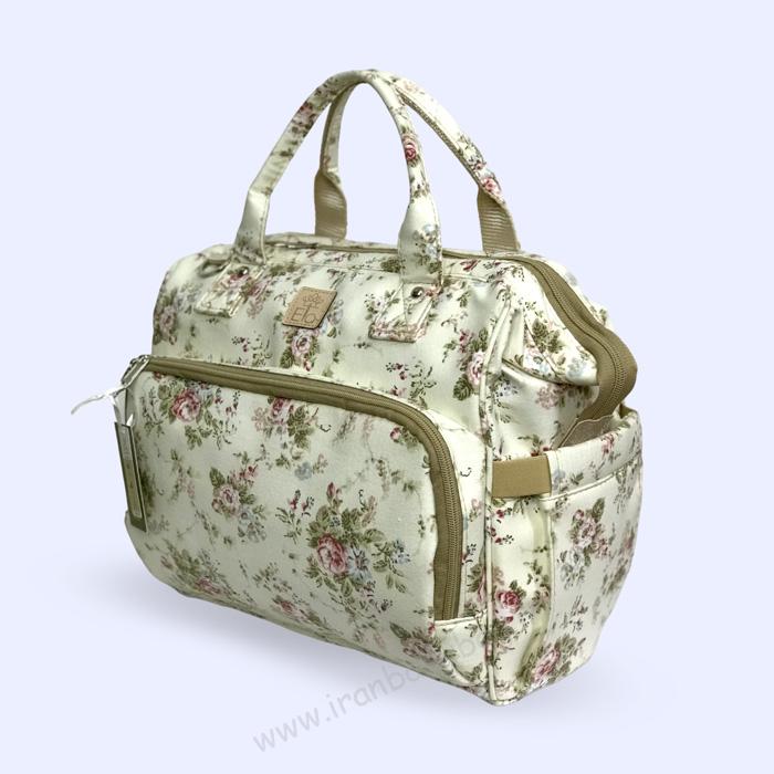 کیف لوازم نوزاد هیوا طرح گلدار کرم کیف رودوشی لوازم نوزاد الا